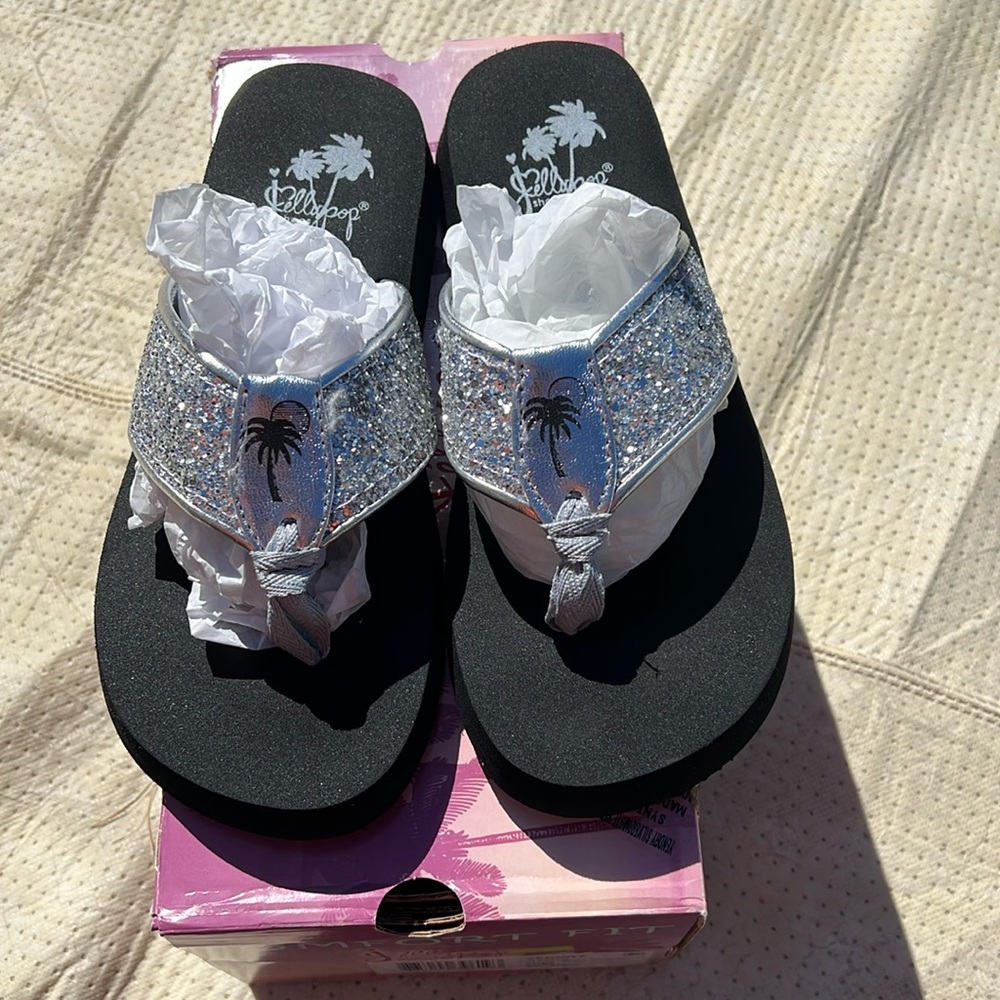 Brand new jelly pop sandals. Not sure on size but 9 inches heal to toe.